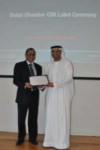 CSR Label certificate presented to Eugene May by Dubai Chamber of Commerce.