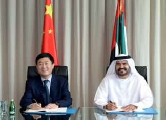 Chief Executive of Jafza and Senior Vice President and Managing Director of DP, UAE Region, Mohammed Al Muallem, and Chief Executive of CNPC Middle East, Zhu Junfen sign the agreement for CMPC to establish its regional HQ in Dubai