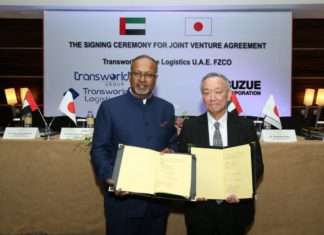 Ramesh S. Ramakrishnan and Takahiro Suzue sign the joint venture agreement
