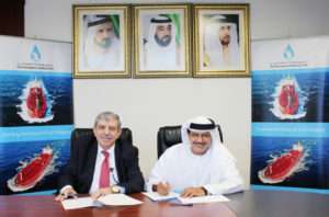 Khamis Juma Buamim and Professor Mustafa Masad signing the MOU following a meeting in Dubai.