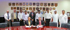 Terry McGowan, President and CEO, Thordon Bearings (seated right), and Mohammad Rizal (left), Chief Operating Officer of Drydocks World-Dubai, sign an agreement that affirms the two companies’ efforts to convert ships to seawater lubricated propeller shaft lines from oil