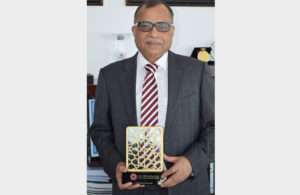 Eugene Mayne receiving the IBX Inspirational Leader award