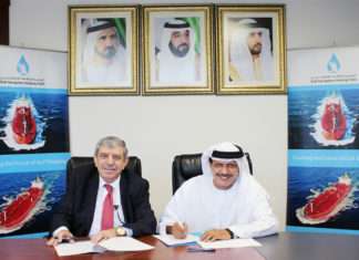 Khamis Juma Buamim and Professor Mustafa Masad signing the MOU following a meeting in Dubai.