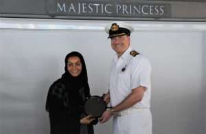 Noura Rashid Al Dhaheri, cruise terminal manager, ADP, presents the captain of Majestic Princess with a special plaque to mark its maiden voyage
