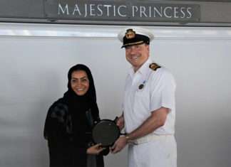 Noura Rashid Al Dhaheri, cruise terminal manager, ADP, presents the captain of Majestic Princess with a special plaque to mark its maiden voyage