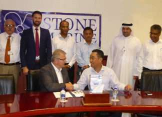 DDW Chief Operations Officer, Mohammad Rizal shaking hands with Don Quilliam, Managing Director of Stone Marine Shipcare, with senior executives from both company’s looking on.