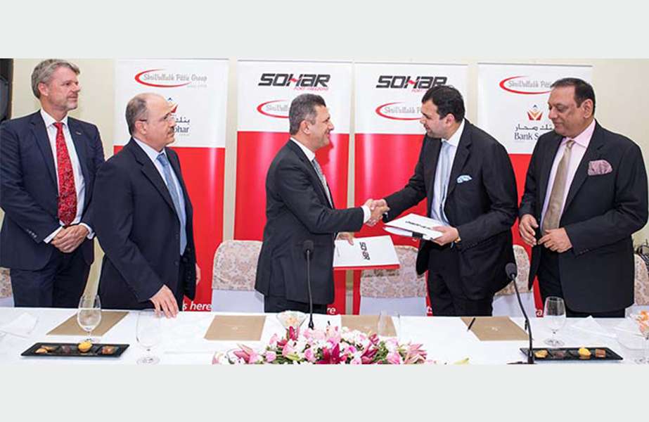 Executives from Sohar Port and Freezone and ShriVallabh Pittie Group signing the land lease MOU