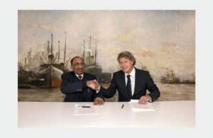 Captain Mousa Murad and Koen Overtoom shaking hands after signing the MOU between the two organisations
