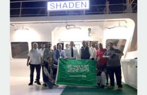 The crew of Shaden celebrating the awarding of national flag status to the vessel