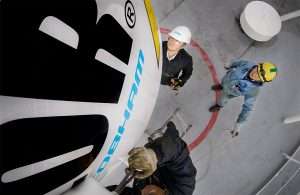 Elcome staff retrofitting Communications system on an LNG carrier