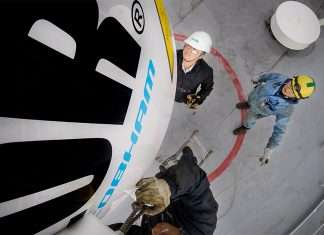Elcome staff retrofitting Communications system on an LNG carrier