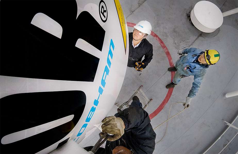 story 8 Elcome staff retrofitting Communications system on an LNG carrier