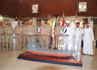 ADSB executives and Kuwaiti Navy staff attend a ceremony to mark the launching of the new landing craft