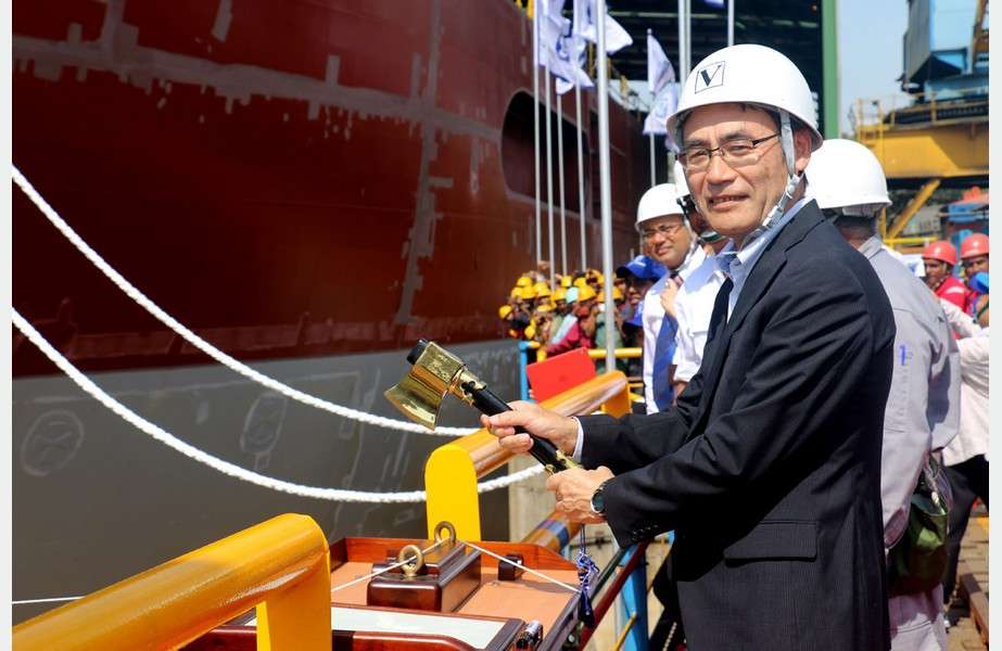 Story 10 Takaaki Anraku, President, Kokusai Cable Ship Company, cutting the rope to break the milk pot against the vessel’s hull