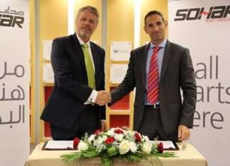 Mark Geilenkirchen, CEO, Sohar Port and Freezone shakes hands with Karim Cordahi, country manager, Svitzer Oman, after signing an agreement for Svitzer to supply and manage two new pilot vessels and provide round-the-clock operational support