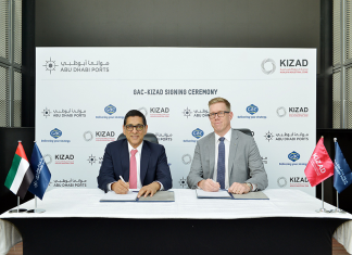Samir Chaturvedi, Kizad chief executive, and Göran Eriksson, GAC Abu Dhabi managing director, signing the agreement to open warehousing and open yard areas in the free zone