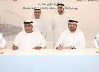 Rashed Lahej Al Mansoori, Director General of the General Administration of Customs in Abu Dhabi, and Shadi Malak, Chief Executive Officer of Etihad Rail, sign the MOU