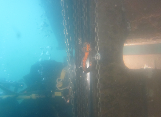 A Hydrex diver performing welding work on the rudder while the vessel was in Jebel Ali
