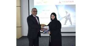 Tristar group Chief Executive, Eugene Mayne, hands over the first copy of the 2019 sustainability report to Emirates Environmental Group chairperson, Habiba Al Marashi