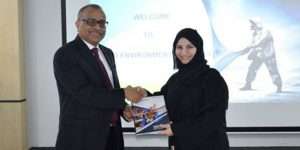 Tristar group Chief Executive, Eugene Mayne, hands over the first copy of the 2019 sustainability report to Emirates Environmental Group chairperson, Habiba Al Marashi
