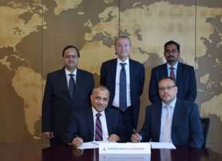 Eugene Mayne (left) of Tristar and Greg Stevens signing the joint venture contract. Witnessing are Tristar officers Balaji Nagabhushan, Marco Bachechi and Sybi Kuruvilla Varghese