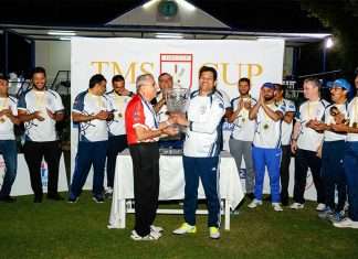 Winning Captain of TMS, Trevor Pereira receiving the TMS Cup from Freddy Sidhwa, Captain of the Rest of Shipping.