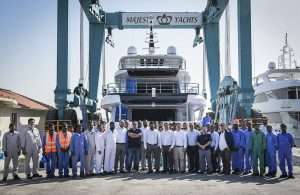 Gulf Craft staff gather in front of the newly launched Majesty 120