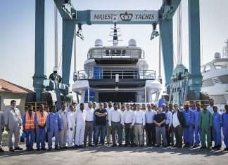 Gulf Craft staff gather in front of the newly launched Majesty 120