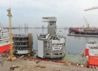 The TMS components being loaded onto a heavy lift vessel prior to departing Drydocks World