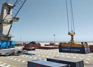The first containers of fish oil being loaded at Duqm port