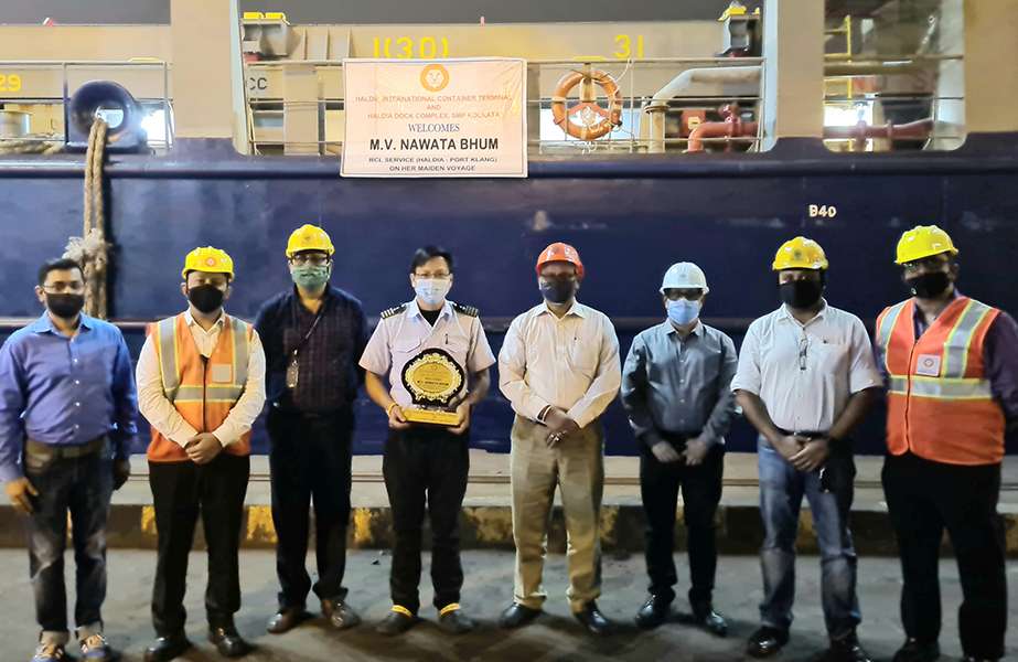 Port officials mark the maiden call of the Nawata Bhum at HITC