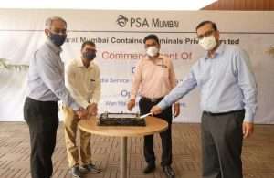 Executives cut a cake to mark the arrival of the first call in the new Wan Hai/Interasia service from PSA Mumbai to the Far East