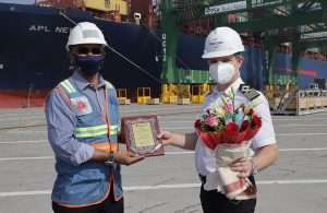 The captain of APL New York receiving a memento and gift to mark the maiden call of the new EPIC service