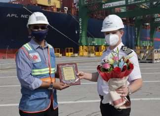 The captain of APL New York receiving a memento and gift to mark the maiden call of the new EPIC service