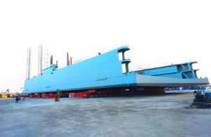 A 1,450 tonnes drydock being transported from the fabrication facility to the quayside.