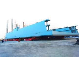 A 1,450 tonnes drydock being transported from the fabrication facility to the quayside.