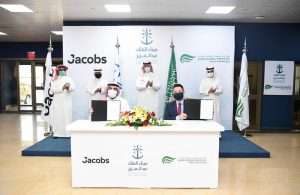 Edward Tah (front, right) and Jacobs’s Business Development Director Omar Al Zahrani (front, left) holding the letters of award to appoint Jacobs as SGP’s civil engineering consultant. Witnessing the event are SGP’s Chairman, Abdulla Al Zamil (rear, right), Mawani President H.E. Omar Hariri (rear, second from right), Jacobs’s Market Director, Abdulelah Alsheikh (rear, second from left) and Mawani’s Director General for King Abdulaziz Port Hassan Faqeha (rear, left)