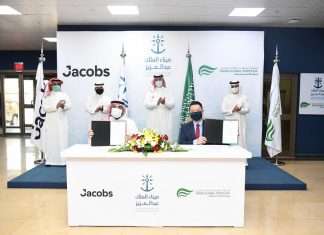Edward Tah (front, right) and Jacobs’s Business Development Director Omar Al Zahrani (front, left) holding the letters of award to appoint Jacobs as SGP’s civil engineering consultant. Witnessing the event are SGP’s Chairman, Abdulla Al Zamil (rear, right), Mawani President H.E. Omar Hariri (rear, second from right), Jacobs’s Market Director, Abdulelah Alsheikh (rear, second from left) and Mawani’s Director General for King Abdulaziz Port Hassan Faqeha (rear, left)
