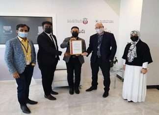Robert Sutton, Head of Logistics Cluster, AD Ports Group, receiving the GDP Accreditation Certificate from Bureau Veritas’ representative in the presence of a number of the Group’s officials.