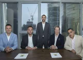 Mycrane founder Andrei Geikalo, standing, is pictured with new franchise partners following the signing of partnership agreements in Dubai