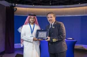 Esam Ahmad, P&O Marinas, presenting a custom-made plaque to Captain Marco Massa of MSC World Europa