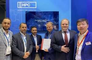 Executives from Misurata Free Zone and HPC signing the container crane contract