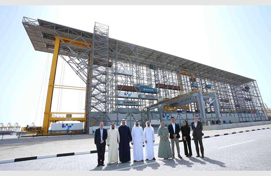 Abdulaziz Alobaidli, the Chief Operating Officer of Masdar and Mohammed al Muallem, Executive Vice President of DP World, with a group of senior officials, at the site of the revolutionary Bombay High Bay Storage (HBS) system in Jebel Ali, Dubai