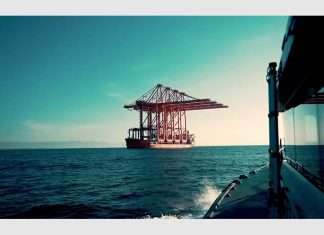 Four new ship-to-shore container cranes arriving in Salalah on a heavy lift ship