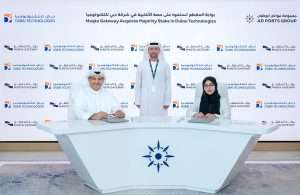 Capt. Mohamed Juma Al Shamisi, Managing Director and Group CEO, AD Ports Group, witnessing the signing of the agreement by Dr Noura Al Dhaheri, CEO of Maqta Gateway, and Ahmed Alrafi, Founder of Dubai Technologies
