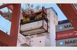 Tank containers filled with fresh water being offloaded in Salalah