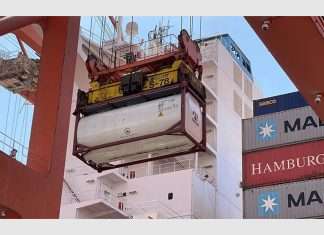Tank containers filled with fresh water being offloaded in Salalah