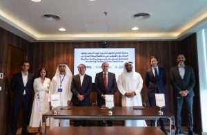 Executives from AD Ports, Transmar and Orasacom signing the MOU to establish a green methanol bunkering facility in the Suez Canal area