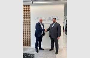 Richard Jacobsen, Sales Director EMEA Maritime at Orbcomm (left), and Mohamed Badawi, Chief Operating Officer of Folk Maritime (right), shake hands on the new partnership