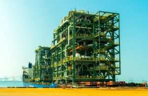 The modules being loaded onto a heavy lift vessel at Khalifa Port in Abu Dhabi